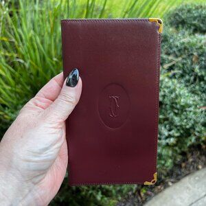 Cartier Les Must Bordeaux Leather Passport Wallet Embossed Logo, Gold Corners